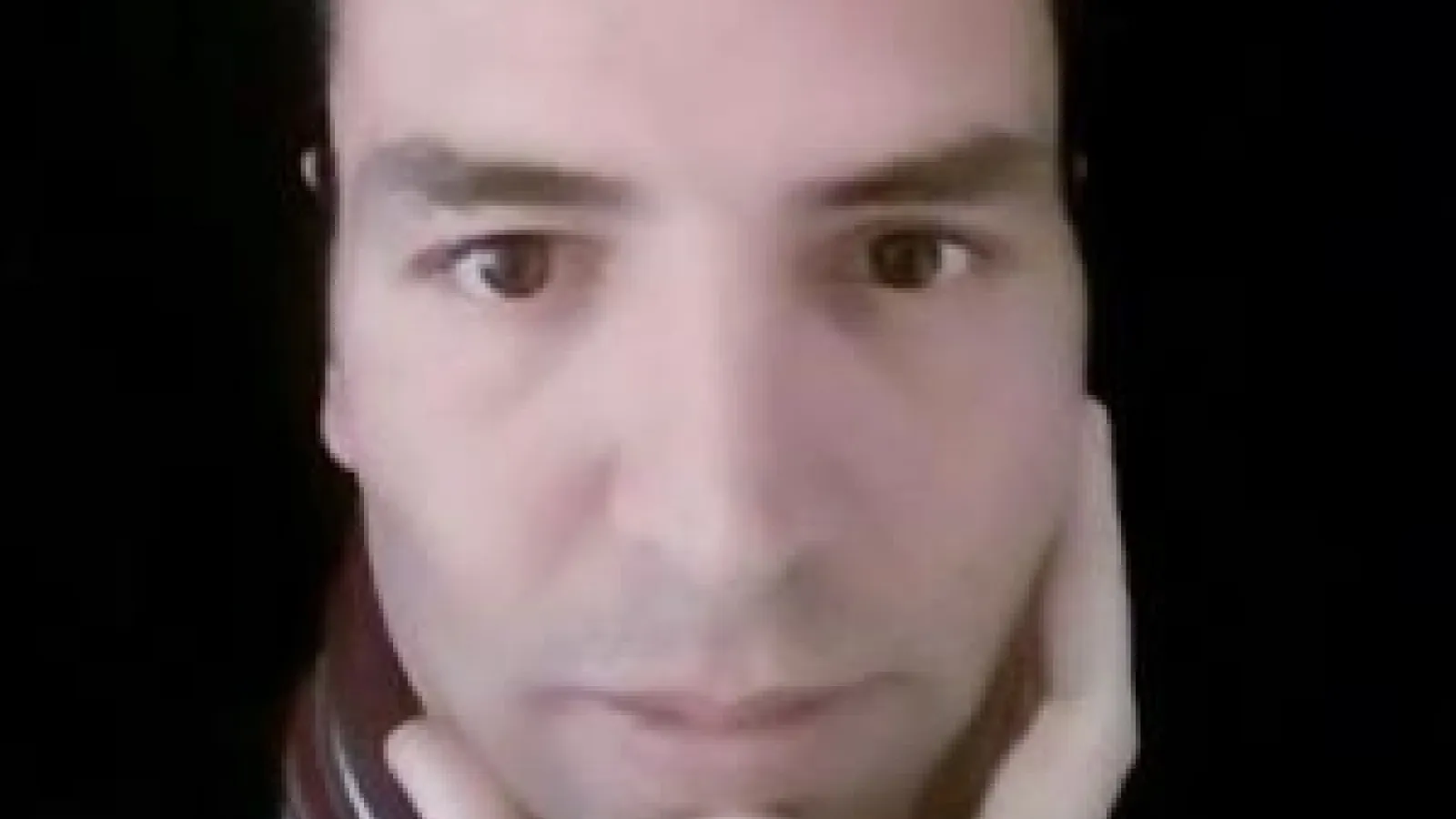 a close up of Hekmat's face