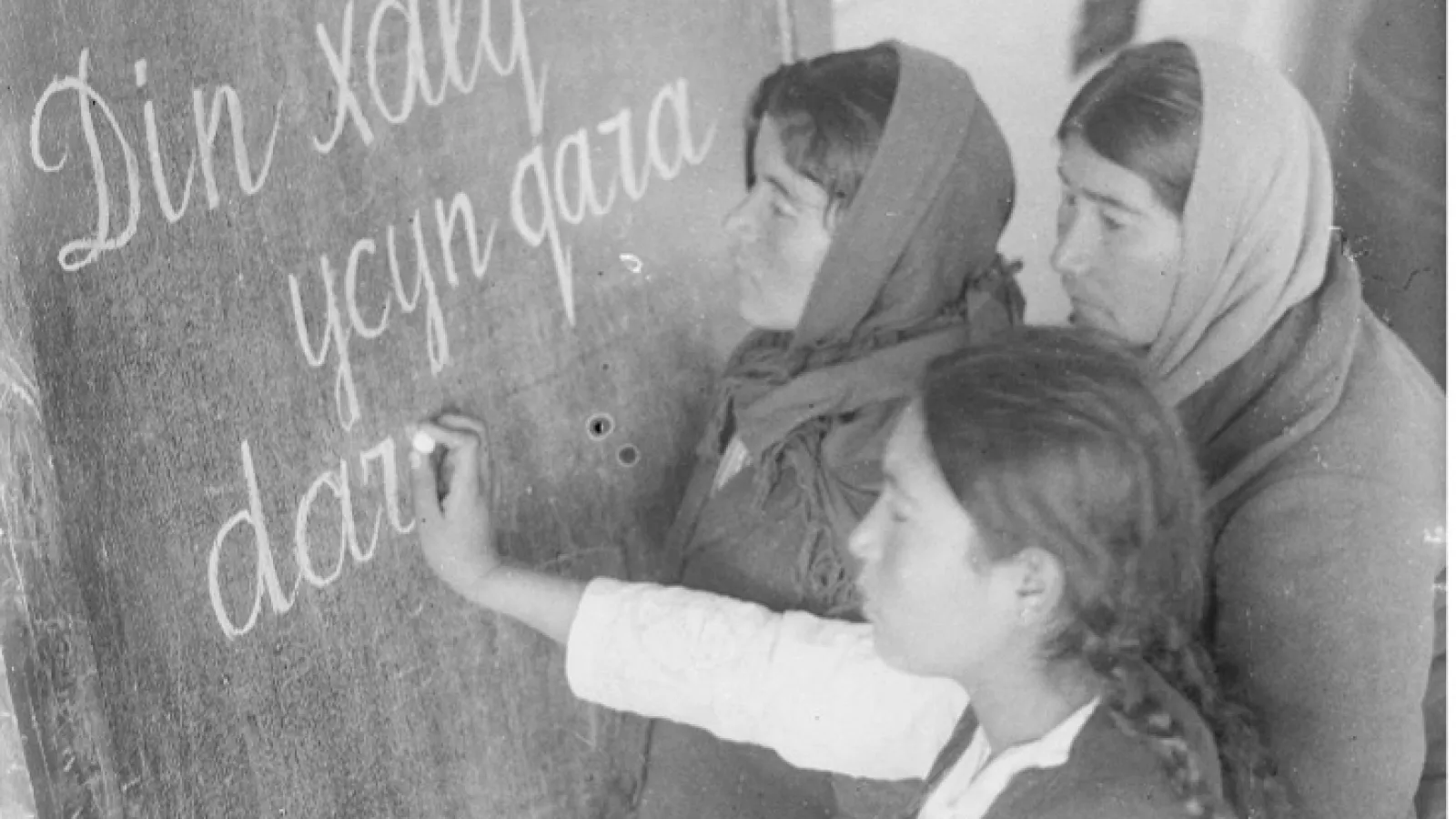 students at chalkboard