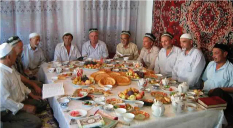 people sitting on a table with food 