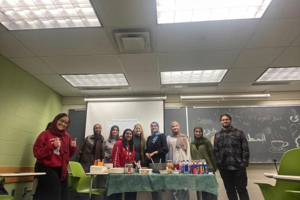 Students in front of food and presentation