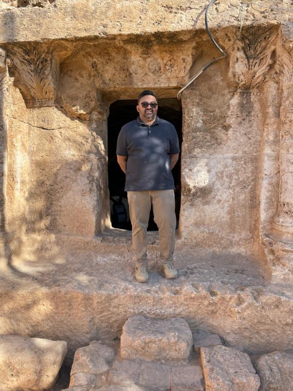 Image of a man in front of the entrance to the purported cave of seven sleepers in Jordan