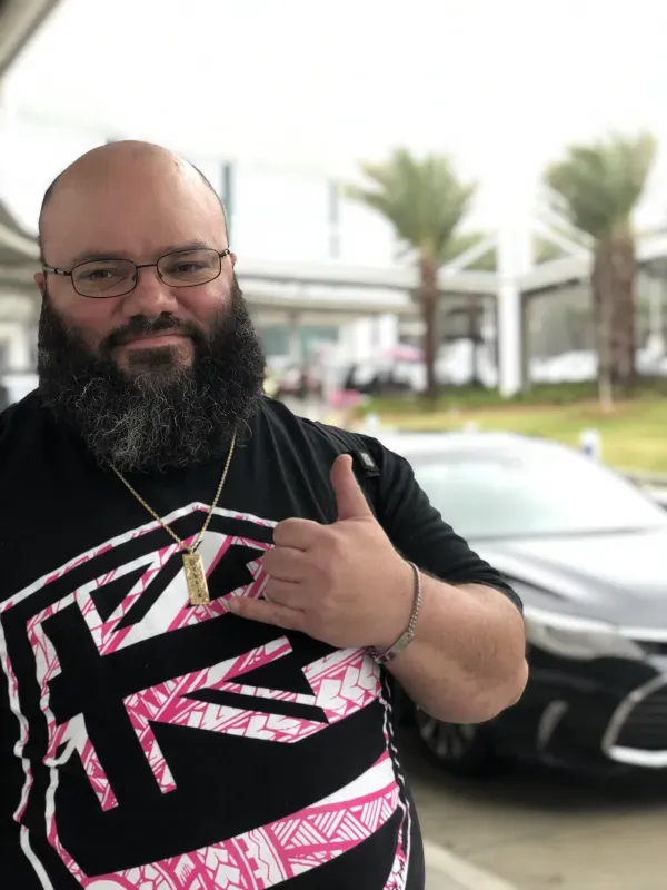 Clint Awai-Jennings giving hang loose sign 