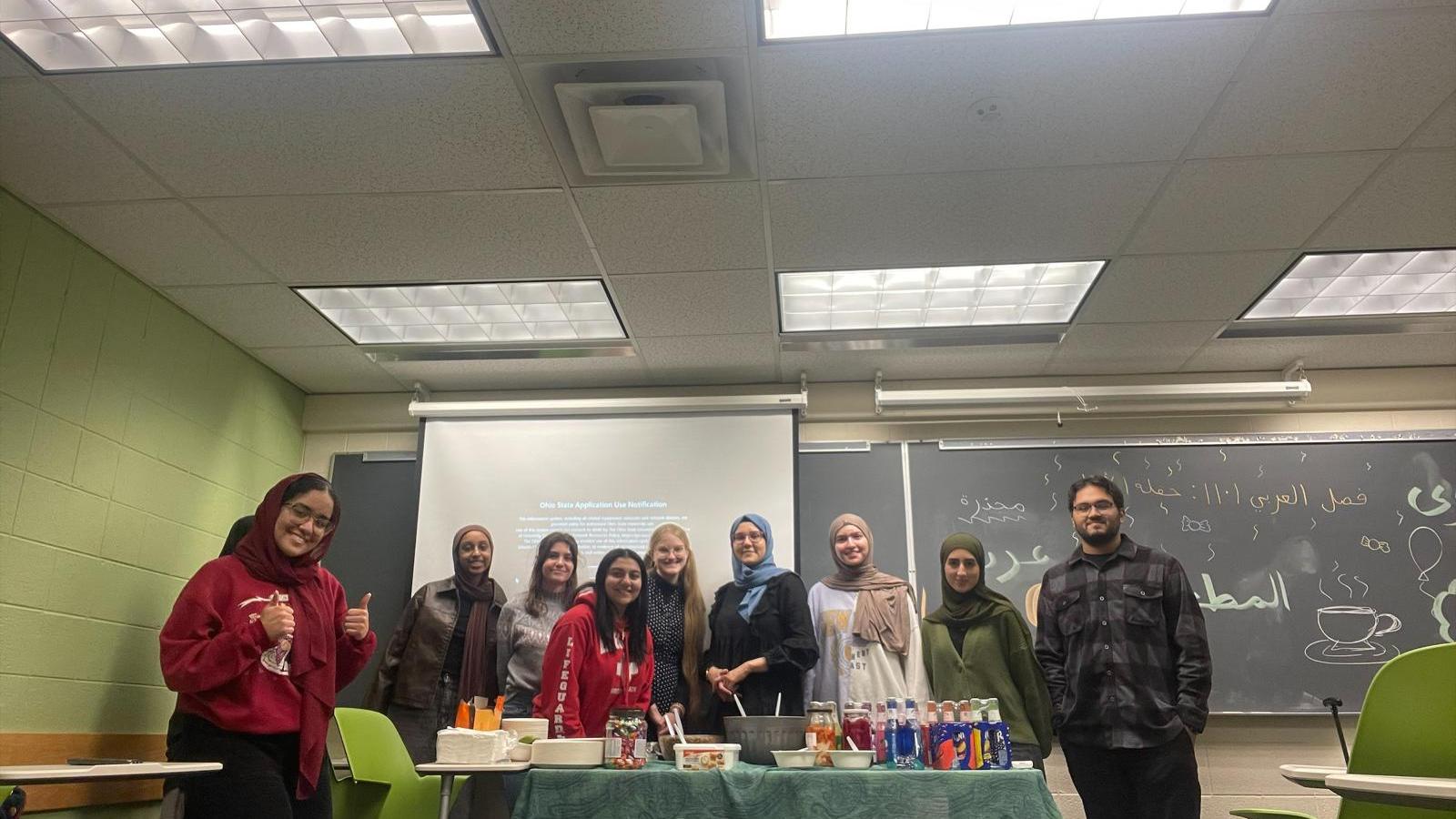 Students in front of food and presentation